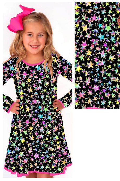 Girls dress with glittery stars and rainbow colors